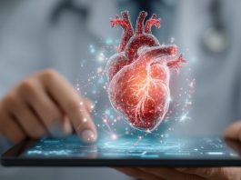 Digitale Herzdiagnostik in einer Praxissoftware: 3D-Darstellung eines menschlichen Herzens über einem Tablet, Symbol für Kardiologie, Telemedizin und digitale Patientenversorgung.